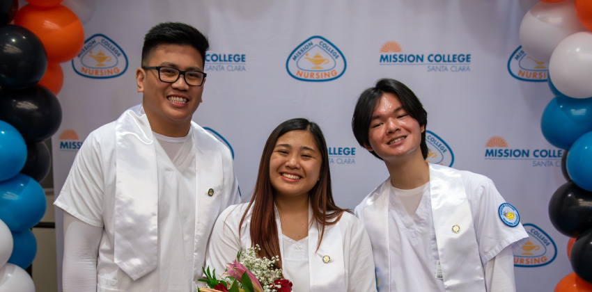 Three smiling nursing students